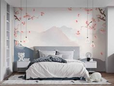 the bedroom is decorated in white and pink with cherry blossoms on the tree wallpaper