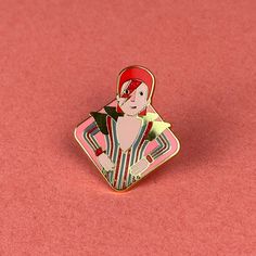 a pin with a woman holding a star on top of it's lapel