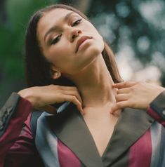 a woman with her hands on her neck