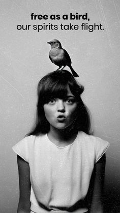 a girl with a bird on her head and the words free as a bird, our spirits take flight