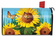 a mailbox with sunflowers and butterflies painted on it