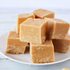 peanut butter fudge out of this world fudge recipe on a white plate with text overlay