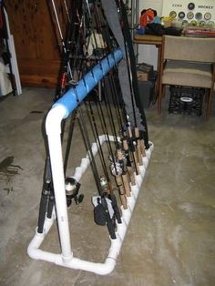 a rack full of skis and poles in a room with a table behind it