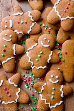 a pile of ginger cookies with white icing and sprinkles