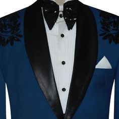 Bold, Sophisticated, and Unforgettable Teal Blue Italian Tuxedo for Groom Make a stunning entrance in our stunning Teal Blue Tuxedo, crafted from premium Italian fabric and embellished with intricate black hand-embroidered embellishments. It's not just a suit; It's a masterpiece designed to elevate your special day. The centerpiece of this ensemble is a stunning teal blue tuxedo jacket, with a sleek black satin shawl lapel that adds a touch of modern elegance. Double flapped pockets and a front Fitted Blue Suits For Ceremony, Fitted Blue Set For Ceremony, Fitted Blue Sets For Ceremony, Tailored Blue Suit For Ceremony, Royal Blue Formal Sets, Blue Tuxedo Formal Sets, Formal Blue Tuxedo Set, Tailored Royal Blue Party Sets, Blue Luxury Wedding Sets