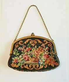 "1930s Art Deco Small Petit Point Purse, 30s Needlepoint Tapestry Evening Bag, Vintage Accessory Beautiful 1930s Art Deco small petit point purse. It features: A single dainty brass chain handle. Brass decorative brass frame. Black rocker knob clasp closure that works well and closes tightly. Opens to a satin lining with one interior side open pocket. Made In Austria stamped on the pocket (faded). Excellent vintage condition *missing some of the small stones on the frame. The lining is clean and Needlepoint Tapestry, 1930s Art, 1930s Art Deco, Brass Decor, Bag Vintage, Beaded Bags, Brass Frame, Brass Chain, Vintage Vibes