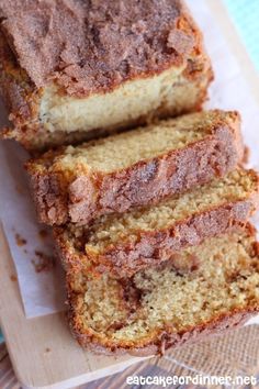 sliced loaf of banana bread sitting on top of a cutting board