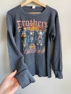 RARE Super trendy vintage Harley Davidson long sleeve waffle weave shirt from the 1980s Band of Brothers print on front H&M Dover Ohio on back Size XL vintage sizing fits more like a modern day large super hard to find style Very vintage Harley shirt Authentic wear super cool ✨ Overall great vintage condition from this era but wear on sleeve and neckline as shown and one or two small holes Vintage Long Sleeve T-shirt For Winter, Retro Ribbed Winter Tops, Winter Long Sleeve Graphic Shirt, Vintage Tops For Streetwear In Fall, Vintage Tops For Fall Streetwear, Casual Long Sleeve Waffle Knit Top, Retro Long Sleeve Shirt For Streetwear, Vintage Ribbed Crew Neck Tops, Vintage Relaxed Fit T-shirt For Winter