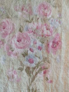 an old piece of cloth with pink flowers on it