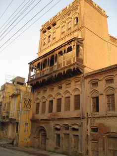 an old building with many windows and balconies