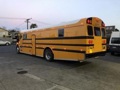 a yellow school bus parked in a parking lot