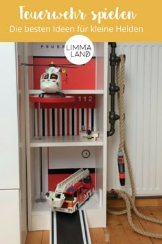 a book shelf filled with toys on top of a hard wood floor next to a white wall