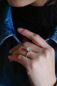 a close up of a person wearing a ring