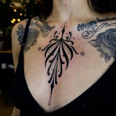 a woman with a tattoo on her chest