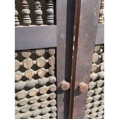 an old wooden door with some knobs on it