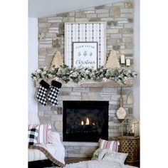 a living room decorated for christmas with stockings on the mantel and plaid stockings hanging over the fireplace