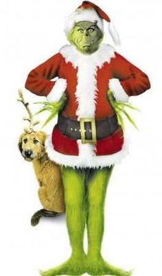 the grinch is standing next to his dog