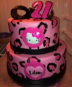 a hello kitty themed birthday cake with the number twenty on it's tiers