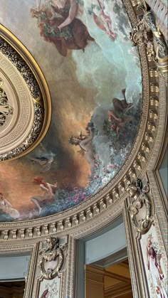 an ornate painted ceiling in a building