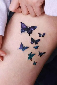 a woman's thigh with butterflies on it