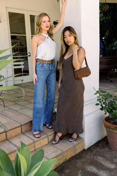 Two woman standing. one blonde dressed in jeans and a white tank top with stappy heel sandals on. One in a brown midi dress and brown purse and strappy brown heels on. Both heels are convertible and customizable. Turn them to flats, blocks, stilettos, or flare blocks in seconds. Shark Tank, Red Hot