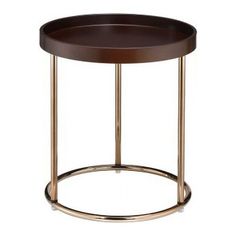 a round wooden table with metal legs and a brown tray on the bottom that has a gold ring around it