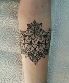 a woman's leg with a tattoo on it and a flower in the middle