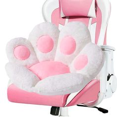 a pink and white chair with fuzzy feet on it's seat cushion, in front of a white background