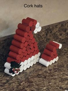 a christmas decoration made out of legos sitting on a counter next to a wall