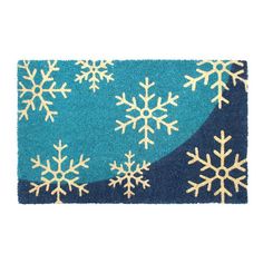 a blue rug with white snowflakes on it