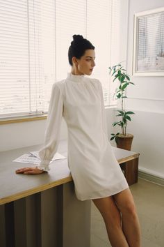 Trixibelle Satin Mini Dress Short Wedding Dress With Long Sleeves Details High Neck Mini Dress - Etsy Vietnam Mini Wedding Dresses Long Sleeve, Cream Long Sleeve Mini Dress For Wedding, Chic White Long Sleeve Mini Dress, Elegant White Mini Length Long Sleeve Dress, Short Wedding Dress With Sleeves, White Winter Dress, Wedding Mini Dress With Sheer Sleeves, Chic White Mini Dress With 3/4 Sleeves, Long Sleeve High Neck Dress