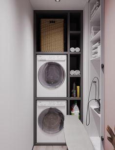 a washer and dryer in a small room with shelves on the wall behind them