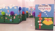 several bulletin boards are decorated with colorful flowers and signs that say welcome to seussville