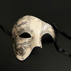 The Phantom mask, known for its association with Venetian parties and extravagant operas that exude history, would also make you stand out in any other gathering. Luxury Masks For Costume Party, Venetian Mask For Theater Halloween, Venetian Masks And Prosthetics For Halloween Theater, Full Face Mask For Costume Party Carnival, Full Face Masks For Costume Party At Carnival, Costume Mask For Festivals, Full Face Carnival Costume Masks And Prosthetics, Full Face Masks For Mardi Gras Costume Party, Festival Costume Mask