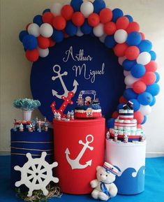 there is a blue and red table with an anchor, snowflakes, and other decorations