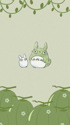 an image of two animals sitting in the middle of some green plants with leaves on them