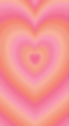 an abstract pink and orange background with a heart shape in the center, as if it were blurred or blurry