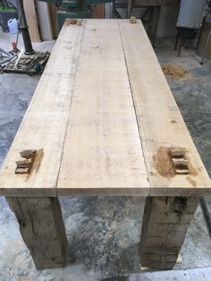 a table made out of wooden planks in a workshop