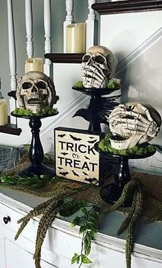 halloween decorations with fake skulls and candles