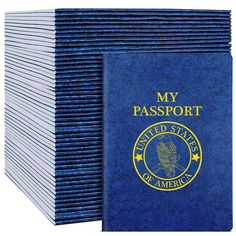 a stack of blue passports with the words my passport printed on it and an american flag