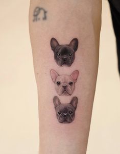 three small dogs are shown on the right forearm and left leg, with one dog's head in the middle