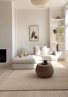 a living room filled with furniture and a fire place