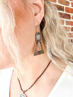 Bourbon Cowgirl earrings are the best gift for an authentic cowgirl. Spirited women will boldly and proudly wear such a unique and beautiful pair of earrings. This showpiece earring set features a gorgeous sterling silver concho with a copper dangle that is hand stamped with cowgirl symbols and lettering. Handmade in Idaho by Weathered Soul exclusively for Bourbon Cowgirl. Limited Edition, high quality jewelry that is as unique and authentic as you! Due to their handcrafted nature, slight variat Cowgirl Earrings, High Quality Jewelry, Earrings Set, Quality Jewelry, Best Gift, Idaho, Bourbon, Earrings Handmade, Hand Stamped