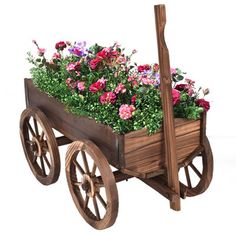 a wooden wagon filled with lots of flowers