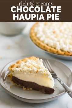 a piece of chocolate and cream pie on a plate with a fork next to it