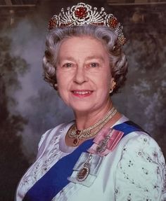 an older woman wearing a tiara and smiling