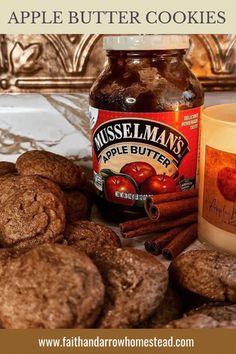 an apple butter cookie next to a jar of apples