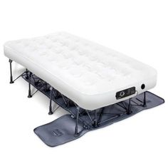 an inflatable mattress is sitting on top of a snowboard