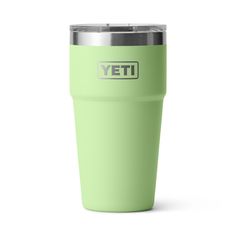 a green yeti cup with the word yeti printed on it's side