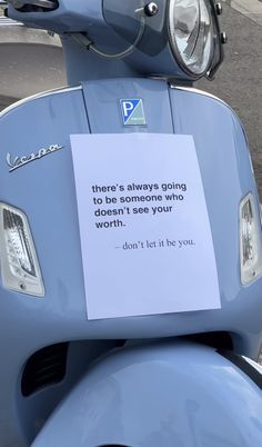 a blue scooter with a note attached to it's headlight and the words, this is always going to be someone who doesn't see your worth